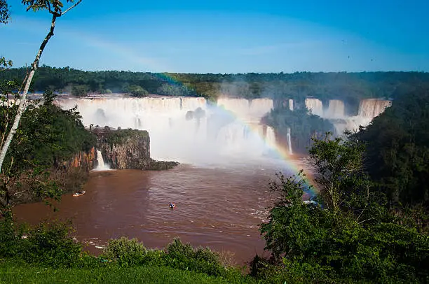 Rainbow over gorgeous waterfalls of Iguazu, Brazil.