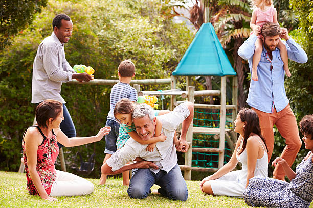 istock Adults and kids having fun playing in a garden 480473620