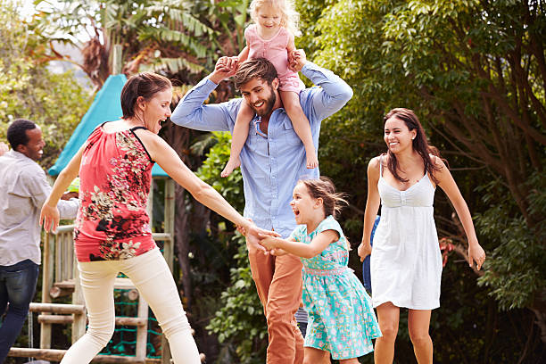istock Adults and kids having fun playing in a garden 480473628