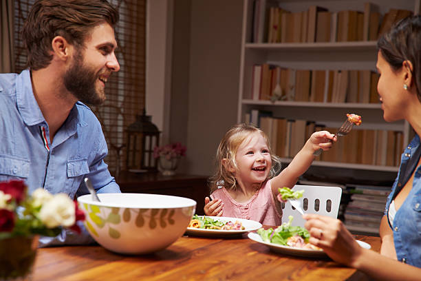 istock Family eating an dinner at a dining table 480473710