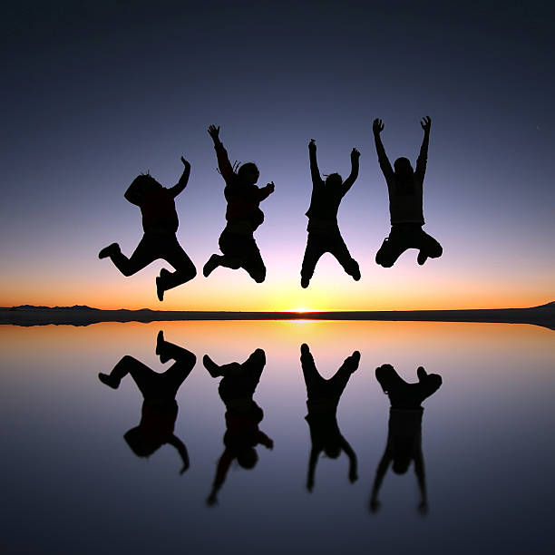 istock Happy friends jumping outdoor 480477131