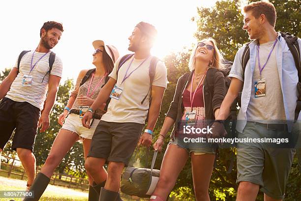 Group Of Young People Going Camping At Music Festival Stock Photo - Download Image Now
