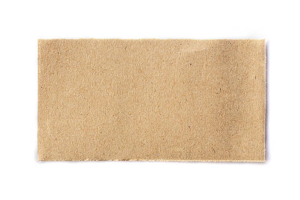 istock brown piece of ripped newspaper on white background 480478415