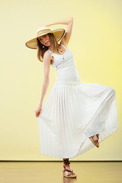 istock Woman in straw summer hat white dress 480480588