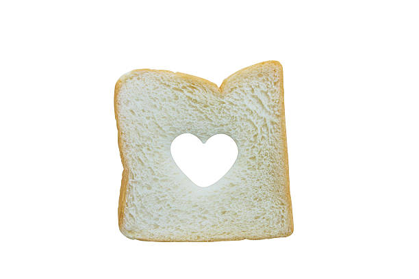 istock Heart shaped hole in a slice of bread isolated 480480950