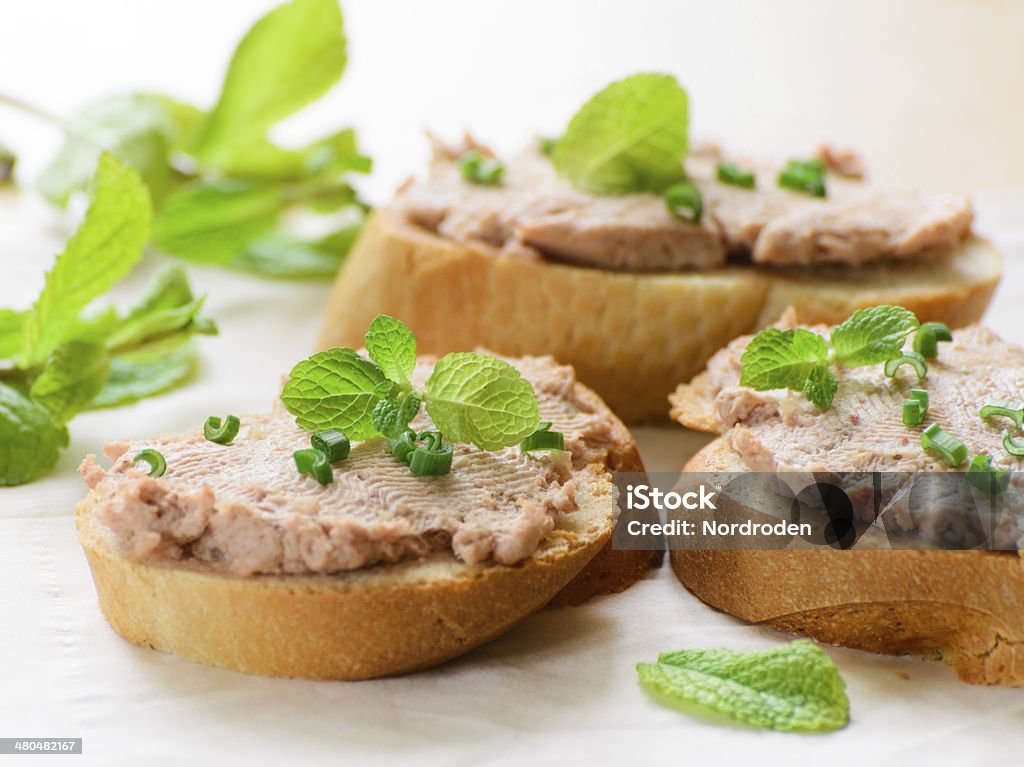 Sandwiches with paste and green onions. Sandwiches with paste and green onions. Served with mint sprigs. Baguette Stock Photo