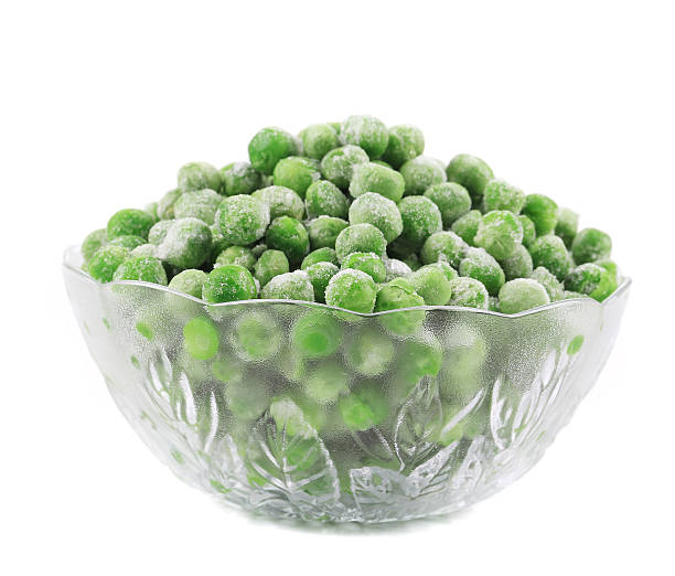 istock Frozen green peas in glass bowl. 480482361