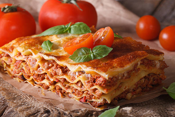 istock Italian lasagna close-up on the table. horizontal rustic 480484258