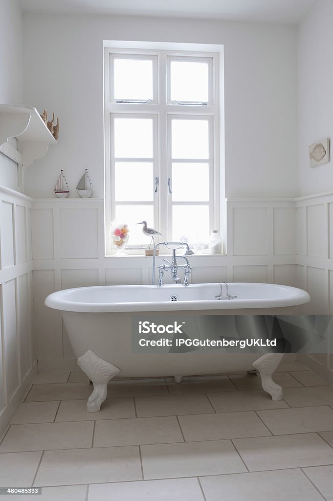 Bathtub In Bathroom Freestanding bathtub in bathroom Apartment Stock Photo