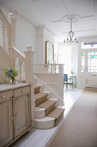 Entry Hall With Stairway Entry hall with stairway and front door carpet runner stock pictures, royalty-free photos & images