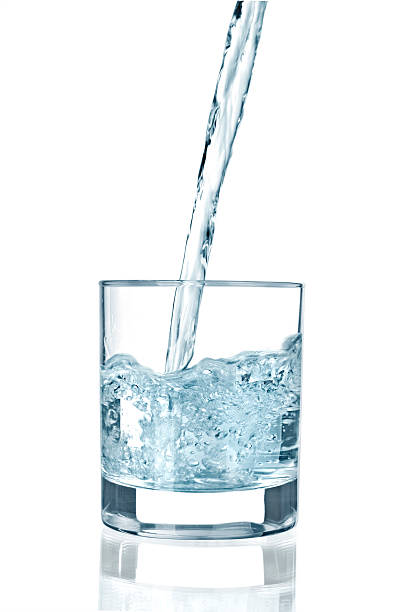 istock pouring water on a glass 480490043