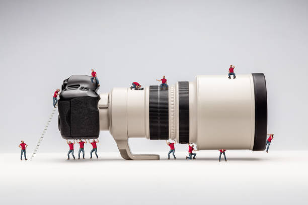 istock Miniature man and camera. Macro photo 480496374
