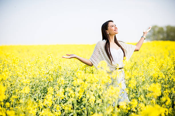 istock Young woman in the spring field 480496920