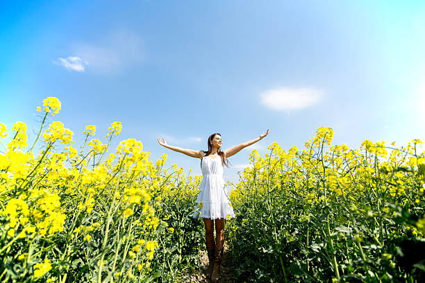 istock Young woman in the spring field 480496938