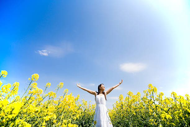 istock Young woman in the spring field 480496940