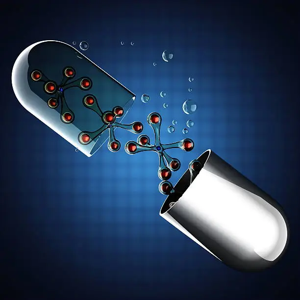 Photo of Transparent capsule on blue background