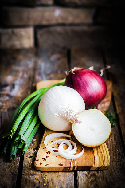 istock colorful onions on rustic wooden background 480499001