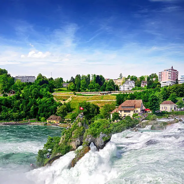 The Rhine Falls is the largest plain waterfall in Europe, near the town of Schaffhausen, Switzerland. Composite photo