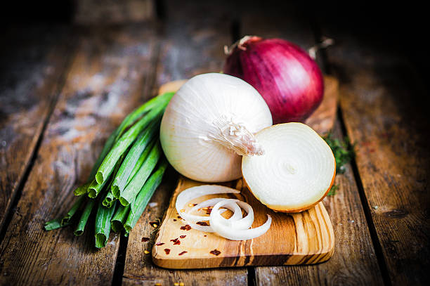istock colorful onions on rustic wooden background 480499327