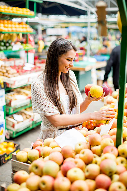 istock Young woman on the market 480499402