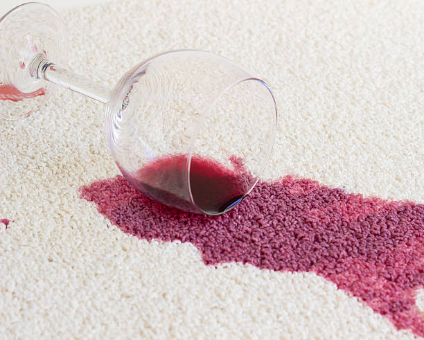 red wine on the carpet stock photo