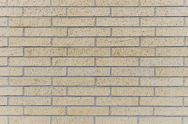 istock White Brick Wall With Yellow Tint Background 480504610