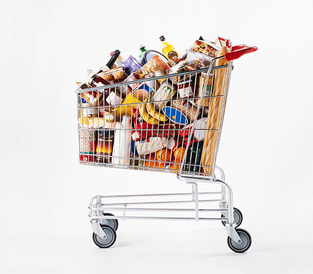 Shopping cart Shopping cart full of food baixa stock pictures, royalty-free photos & images
