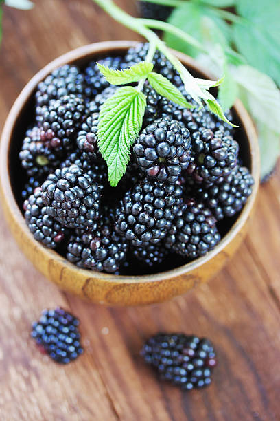 istock berries in a wooden bowl, top,view 480507210