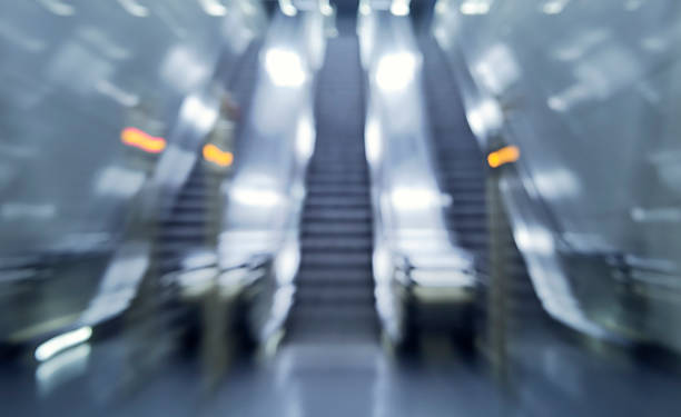istock Zoom picture of three escalators / motion blur 480507492