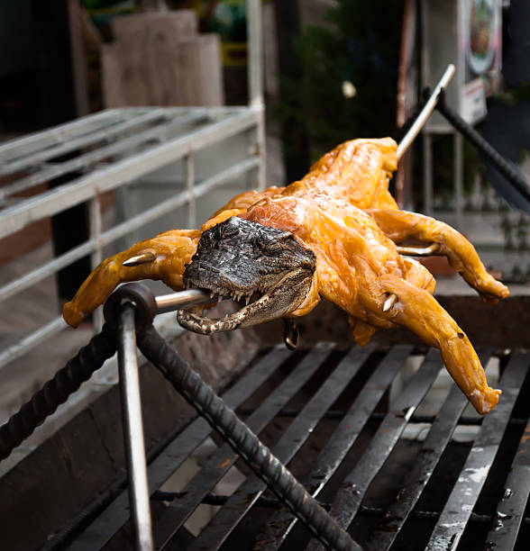Exotic food - crocodile on grill Exotic food - crocodile on grill chinese alligator alligator sinensis stock pictures, royalty-free photos & images