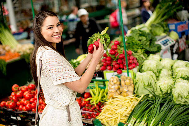 istock Young woman on the market 480507944
