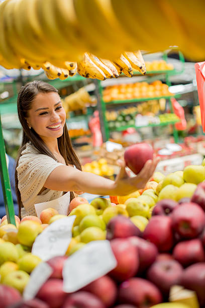 istock Young woman on the market 480508034