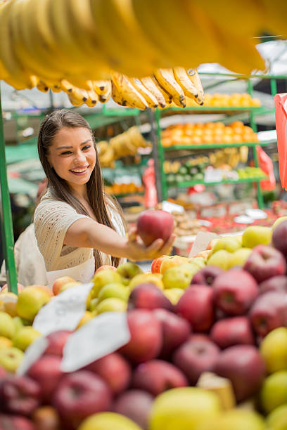 istock Young woman on the market 480508042