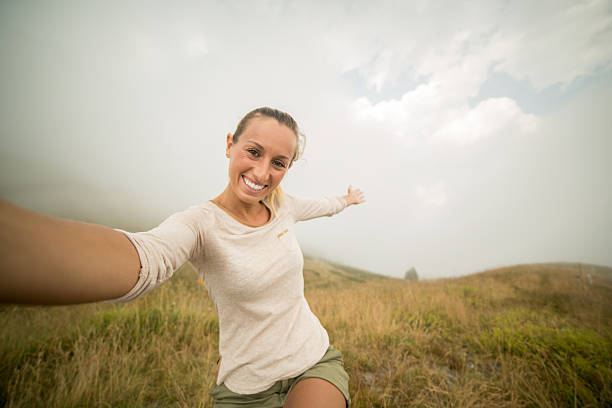 istock Woman loving nature taking selfie 480508082