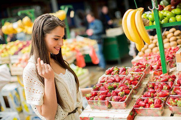 istock Young woman on the market 480508094