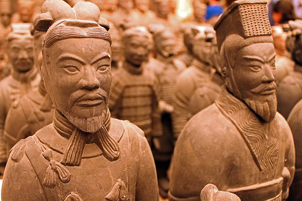 Terra Cotta Warrior Souvenirs Terra Cotta Warrior Souvenirs after stain is applied in Xian. August 2013 qin dynasty stock pictures, royalty-free photos & images
