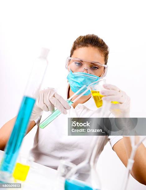 Young Pharmaceutical Phd Scientist Experimenting In Laboratory With Chemical Solutions Stock Photo - Download Image Now