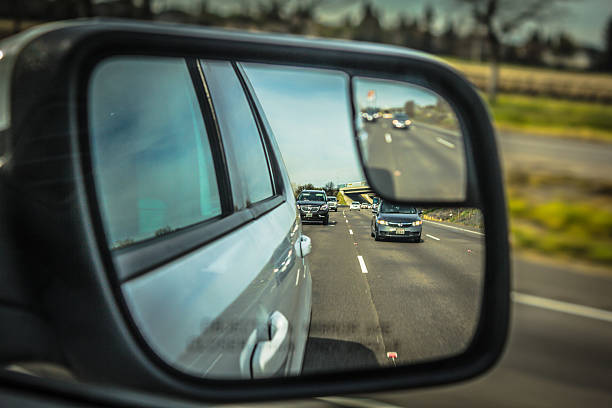 istock Rear mirror reflection of US interstate road, california 480511044