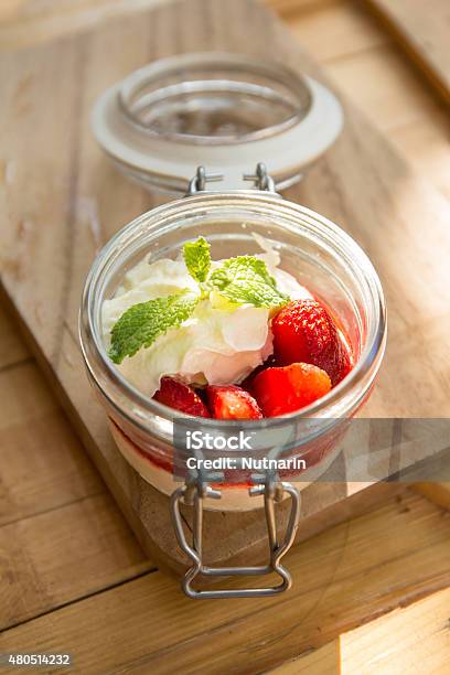 Dessert Panna Cotta With Fresh Strawberries On Wooden Table Stock Photo - Download Image Now