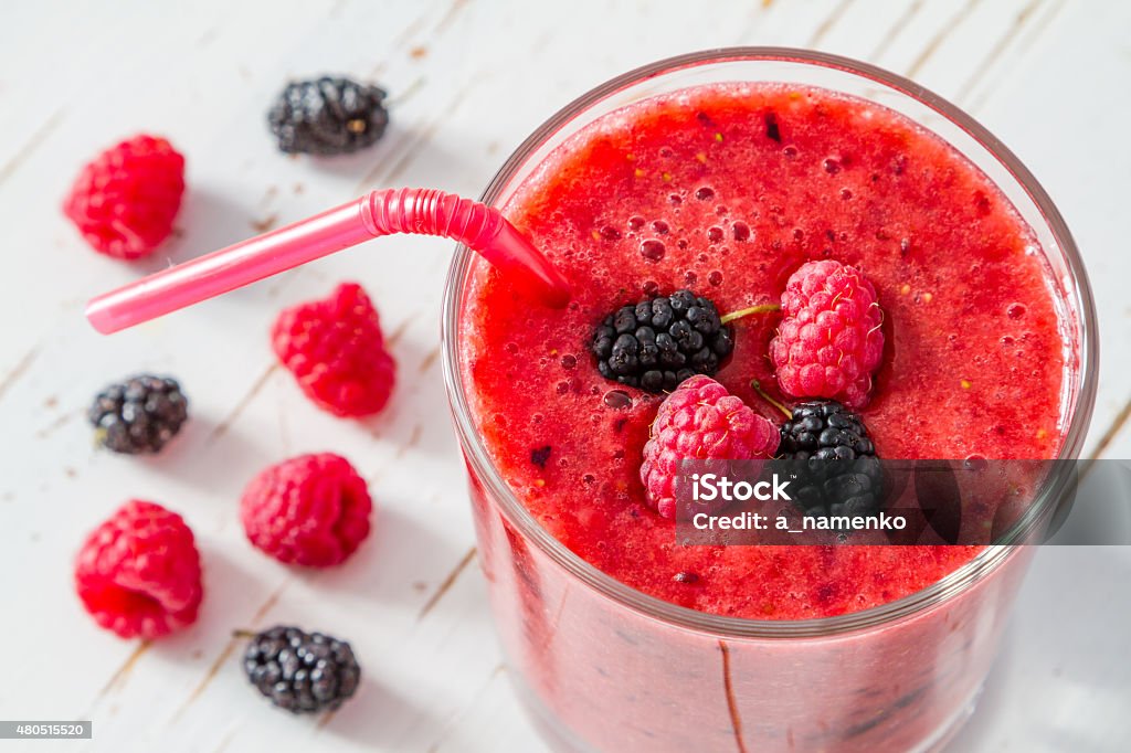 Banana, raspberry and blackberry smoothie,white wood background 2015 Stock Photo