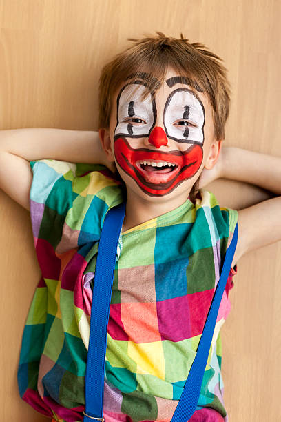 rapaz de palhaço facepaint - face paint human face mask carnival imagens e fotografias de stock
