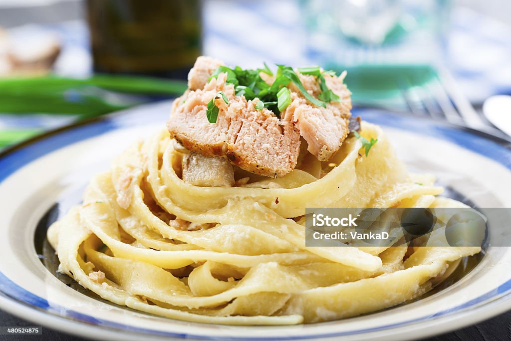 Salmon pasta Delicious salmon pasta with mushrooms on a plate Cheese Stock Photo