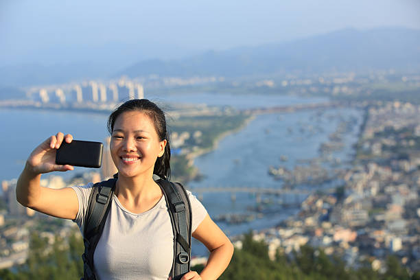 istock woman hiker use smart phone taking self photo 480526971