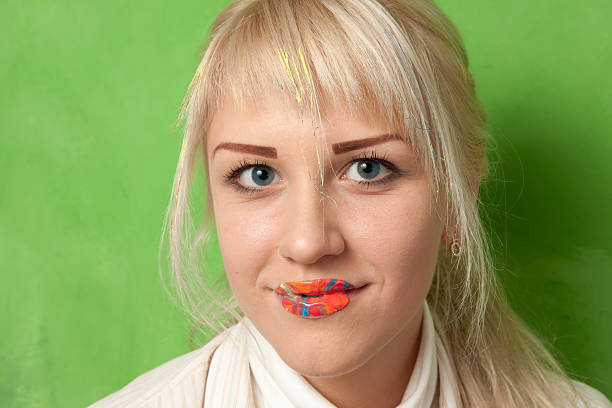 istock Smiling Girl with Lips in Bright Paints 480534768