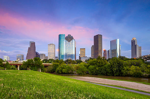 istock Houston Texas  skyline at sunset twilight from park lawn 480535456