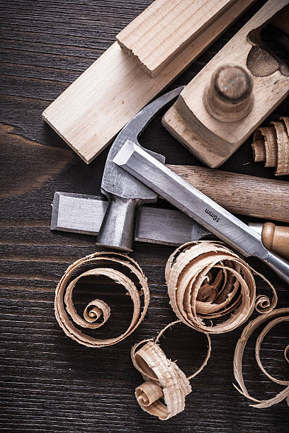 istock Planer hammer chisels wooden studs and curled shavings on vintag 480535604
