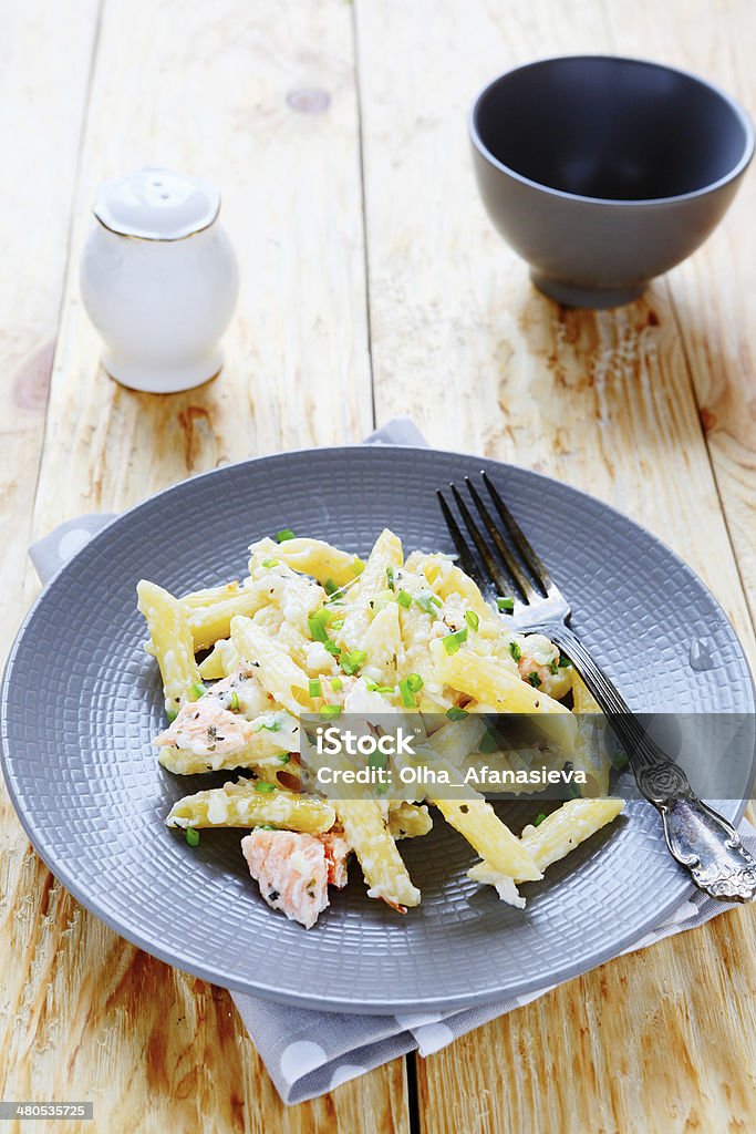 penne pasta with slices of salmon penne pasta with slices of salmon, food closeup Penne Stock Photo