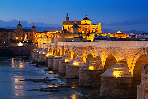 istock Ancient roman bridge over  river in evening. Cordoba 480536082