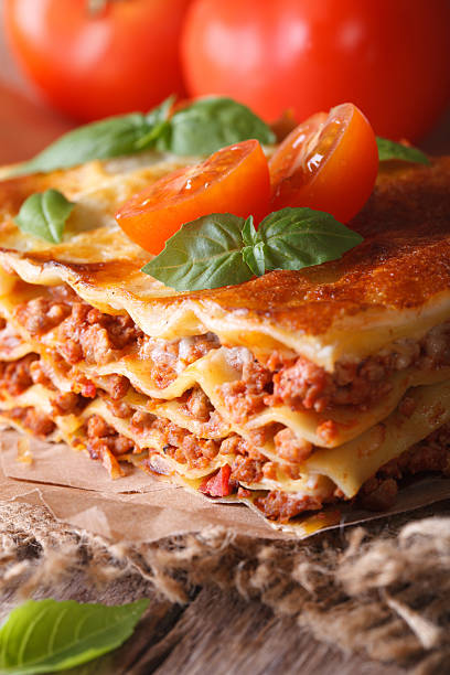 istock Tasty lasagna with basil and tomatoes on table, vertical 480536910