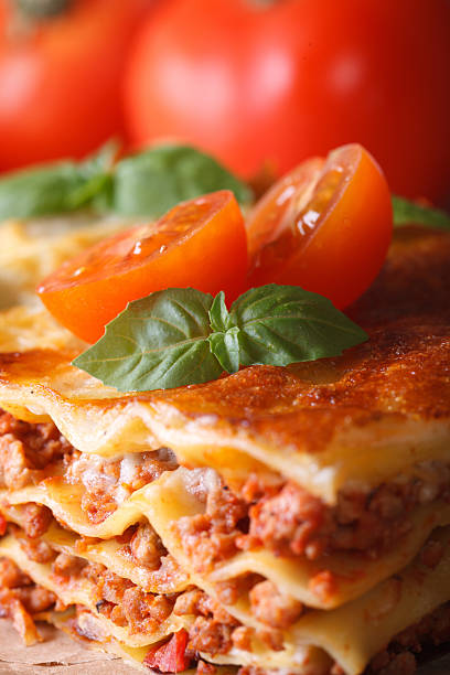 istock Tasty lasagna with basil and tomatoes macro vertical 480536940